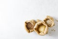 Rice, lentils and white beans in canvas bags, on a light background with a copy of the space.