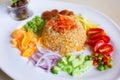 Rice Mixed with Shrimp paste Khao Kluk Kapi is a Thai traditional food was served with shallot, cucumber, mango, caramelized Royalty Free Stock Photo