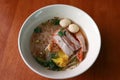 Rice noodle soup and wonton with barbecued red pork and meat ball in the bowl Royalty Free Stock Photo