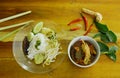 rice noodles and fresh vegetable with spicy chicken feet red cotton tree sauce