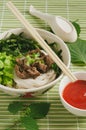 Rice noodles soup with vegetables and meat. Thai food concept.