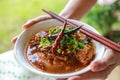 Rice noodles with spicy pork sauce