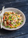 Rice noodles with vegetable stir fry on the ceramic plate Royalty Free Stock Photo