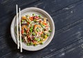 Rice noodles with vegetable stir fry on the ceramic plate Royalty Free Stock Photo