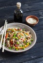 Rice noodles with vegetable stir fry on the ceramic plate Royalty Free Stock Photo