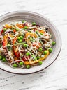 Rice noodles with vegetable stir fry on the ceramic plate Royalty Free Stock Photo