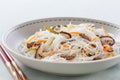 Rice noodles with vegetables, mushrooms and meat