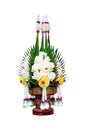 Rice offering decoration with white rose flowers and banana leaf folded in Ancient Thai style call Pan Bai Sri isolated on