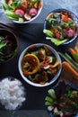 Rice, pickled vegetables in bowls and chopsticks top view. Asian cuisine Royalty Free Stock Photo