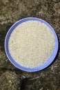 rice on a plastic plate on rock background Royalty Free Stock Photo