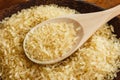 Rice on the plate with wooden spoon Royalty Free Stock Photo