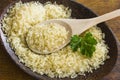 Rice on the plate with wooden spoon Royalty Free Stock Photo