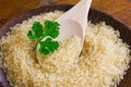 Rice on the plate with wooden spoon Royalty Free Stock Photo