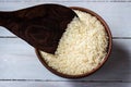 Rice in the plate and wooden spoon Royalty Free Stock Photo