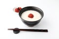 rice porridge with salt pickled plum in bowl chopsticks isolated on white background Royalty Free Stock Photo