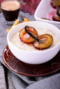 Rice pudding with caramel vanilla plums Royalty Free Stock Photo