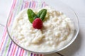 Rice pudding with mint and raspberry Royalty Free Stock Photo