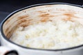 Rice pudding in white plate on dark background Royalty Free Stock Photo