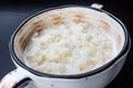 Rice pudding in white plate on dark background Royalty Free Stock Photo