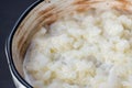 Rice pudding in white plate on dark background Royalty Free Stock Photo