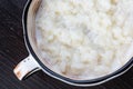 Rice pudding in white plate on dark background Royalty Free Stock Photo