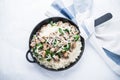 Rice risotto with mushrooms, parmesan and spinach top view on white background