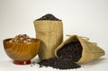 Rice in sacks and in wooden bowls. Royalty Free Stock Photo