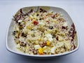 Rice salad on dish, white background Royalty Free Stock Photo