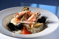 Rice with seafood on a plate in restauant ready to be served Royalty Free Stock Photo