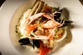 Rice with seafood on a plate in restauant ready to be served Royalty Free Stock Photo