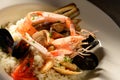 Rice with seafood on a plate in restauant ready to be served Royalty Free Stock Photo