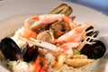 Rice with seafood on a plate in restauant ready to be served Royalty Free Stock Photo