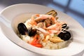 Rice with seafood on a plate in restauant ready to be served Royalty Free Stock Photo