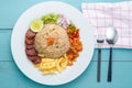 Rice Seasoned with Shrimp Paste, Thai food on white dish over wooden table. Royalty Free Stock Photo