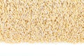 Rice-shaped pasta texture. Rice shaped pasta isolated on white background. View from above. Close-up Royalty Free Stock Photo