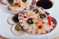 Rice in the shell, decorated with seafood, shrimps, mussels, squid rings and olives. Royalty Free Stock Photo