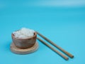 rice in a small wooden bowl and chopsticks Royalty Free Stock Photo