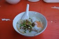 Rice soup or Congee minced pork and entrails with egg