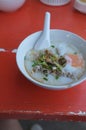 Rice soup or Congee minced pork and entrails with egg