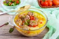 Rice soup with meat balls and vegetables in a transparent glass bowl. Royalty Free Stock Photo