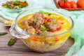 Rice soup with meat balls and vegetables in a transparent glass bowl. Royalty Free Stock Photo