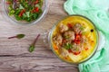 Rice soup with meat balls and vegetables in a transparent glass bowl. Royalty Free Stock Photo