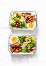 Rice, stewed vegetables, egg, teriyaki chicken - healthy balanced lunch box on a light background. Home food for office