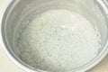 Rice sticked in cooking pot soak water for cleaning