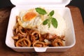 Rice topped with spicy fried squid,