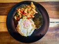 Rice topped with stir-fried chicken and basil with fried egg Royalty Free Stock Photo