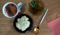 Rice, vegetable soup and coffee on wood background Royalty Free Stock Photo