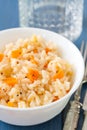 Rice with vegetables in white bowl with glass Royalty Free Stock Photo