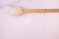 rice in a wooden bowl on a background of natural white stone. healthy eating concept, anti-aging food Royalty Free Stock Photo