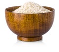 Rice in wooden bowl on white background. Royalty Free Stock Photo